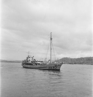 WIDE BAY, NEW BRITAIN, 1945-05-06. THE AK 82 (FORMERLY THE ALMA-DOEPEL), 16 WATERCRAFT COMPANY, ROYAL AUSTRALIAN ENGINEERS, MOVING IN TO BERTH AT THE NEW WHARF