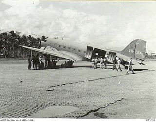 MILNE BAY, NEW GUINEA. 1944-04-06. A DOUGLAS C47 DAKOTA TRANSPORT AIRCRAFT AT GURNEY'S AIR STRIP