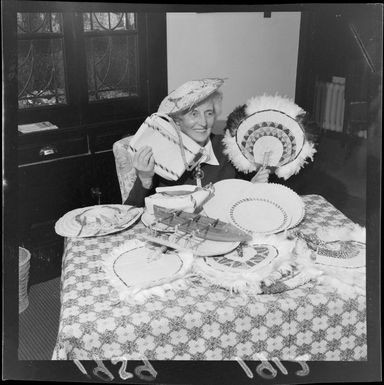 Miss Mary Seaton seated, with gifts from Pacific Island children