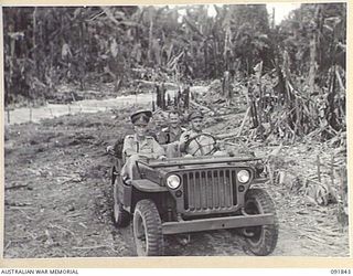 BOUGAINVILLE. 1945-05-10. LIEUTENANT GENERAL V.A.H. STURDEE, GENERAL OFFICER COMMANDING FIRST ARMY (1), ACCOMPANIED BY BRIGADIER J.R. STEVENSON, COMMANDER 11 INFANTRY BRIGADE (3), TRAVELLING ALONG ..