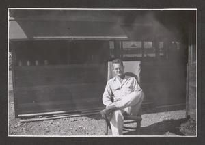 [Henry J. Cates Jr. Sitting on Chair, #3]