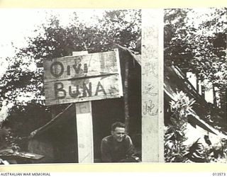 PAPUA. 1942-11-14. ALLIES RETAKE KOKODA. A SIGN POST AT KOKODA