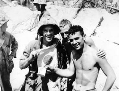 [Marines Holding War Souvenirs]