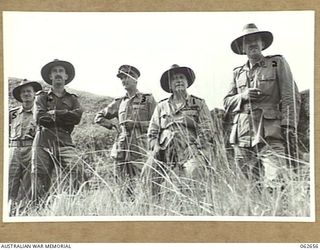 RAMU VALLEY, NEW GUINEA. 1943-12-19. VX1 GENERAL SIR THOMAS BLAMEY GBE KCB CMG DSO ED, COMMANDER-IN-CHIEF, ALLIED LAND FORCES SOUTH WEST PACIFIC AREA (1) AND PARTY LOOKING AT SHAGGY RIDGE AND OTHER ..