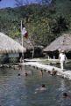 French Polynesia, children swimming near pier at Bora Bora