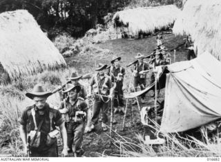 NEW GUINEA. RAMU VALLEY. 20 MARCH 1944. NEAR MENE HILL, LAST POINT AT WHICH CONTACT WAS MADE WITH THE JAPANESE, IN THE FINISTERRES, AN AUSTRALIAN PATROL FROM THE 2/6TH INDEPENDENT COMPANY (LATER ..