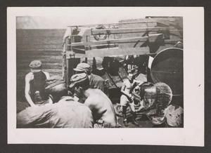 [Men Sitting in Ship]