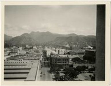 Downtown Honolulu, Hawaii, with buildings, mountains in background
