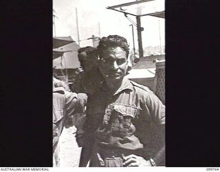 BORAM BEACH, NEW GUINEA, 1945-10-14. JEMADAR (LIEUTENANT) CHINT SINGH, 2/12TH FRONTIER FORCE REGIMENT, WHO FOUGHT IN AFGHANISTAN AND AT SINGAPORE WITH AUSTRALIANS. HE IS ONE OF ELEVEN INDIAN ..