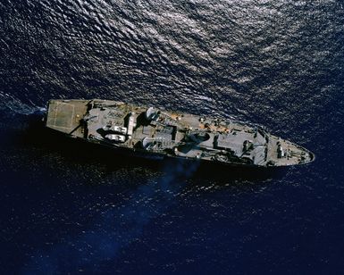 An overhead view of the submarine tender USS HUNLEY (AS 31) underway