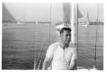 Gaff rigged sailboat in the Nuku'alofa harbour, day of the yacht regatta. (Sione Manu at the helm of Caprice, yacht regatta).