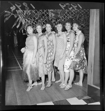 Unidentified young women ushers, dressed in Pacific Island costume, at the Lower Hutt Plunket ball, Wellington