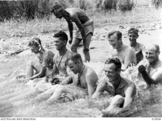 Dumpu, Ramu Valley, New Guinea. 1943. Bath time for Australian troops in a creek at Dumpu