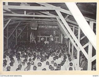 LAE AREA, NEW GUINEA, 1945-07-09. A GENERAL VIEW OF THE HALL DURING THE REVUE "OVER TO YOU" STAGED BY 19 LINES OF COMMUNICATION AREA SIGNALS. IT WAS HELD IN THE UNIT'S RECREATION HUT WHICH WAS ..