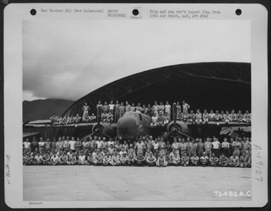 A B-25 Project Crew Of The 13Th Air Depot Group On New Caledonia, Poses On And In Front Of A North American B-25 At Hangar #2 On 22 February 1944. [Airplane Nicknamed 'The Green Hornet' With Art Work, Is A B-25G Which Has Been Modified With The Addition O (U.S. Air Force Number 71481AC)