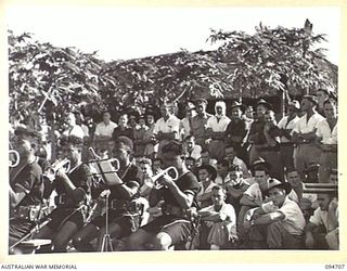 LAE AREA, NEW GUINEA. 1945-08-04. THE ROYAL PAPUAN CONSTABULARY BAND ENTERTAINING PATIENTS AT 2/7 GENERAL HOSPITAL DURING THE ARTS AND CRAFTS EXHIBITION WHICH WAS HELD AT THE RED CROSS SOCIETY HUT