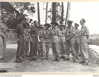 TOROKINA, BOUGAINVILLE. 1945-03-30. LADY WAKEHURST (7), LADY BLAMEY (6), MAJOR R.H. BONNETTE (1), AND COLONEL A.L. DAWKINS (9), SPEAKING WITH PATIENTS AT THE 2/3 CONVALESCENT DEPOT. (FOR ..