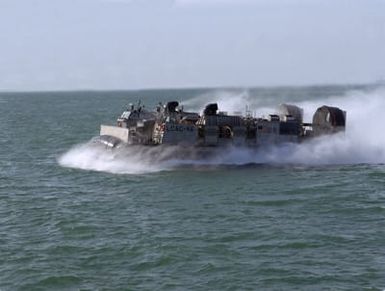 An underway port side view of landing craft air cushion vehicle LCAC-46 during practice beach landings at Naval Station Rota during practice beach landings at Naval Station Rota during a one week turn over by units from Marine Expeditionary Unit 24 (MEU-24) on board the amphibious assault ship USS INCHON (LPH-12) to the Amphibious Ready Force on board the USS GUAM (LPH-9)
