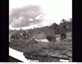 DONADABU, NEW GUINEA. 1943-11-03. LOOKING BACK TOWARDS THE CAMP AREA FROM THE SITE OF THE NEW BRIDGE OVER THE LALOKI RIVER WHICH IS BEING BUILT BY SAPPERS OF THE 24TH AUSTRALIAN FIELD COMPANY, ..