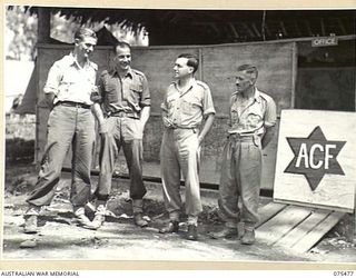 LAE, NEW GUINEA. 1944-08-27. PERSONNEL OF THE AUSTRALIAN COMFORTS FUND HEADQUARTERS OUTSIDE THE UNIT OFFICE AND STORE. IDENTIFIED PERSONNEL ARE:- SX31108 CORPORAL F.S. PATTON (1); VX1444 SERGEANT ..