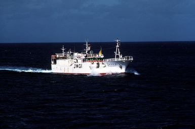 A starboard bow view of a Japanese freighter, taken from the forward lookout deck of the salvage ship USS BOLSTER (ARS 38). Majuro is a large Japanese shipping port