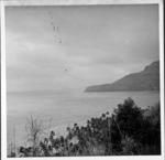 Looking toward Kamaka in haze, with Te Koi Kura, Mangareva in center