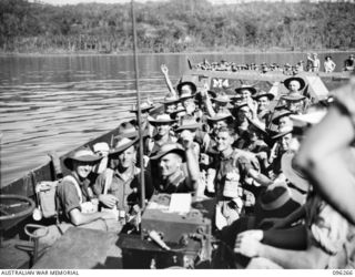 SIMPSON HARBOUR, RABAUL, NEW BRITAIN. 1945-09-10. TROOPS OF A COMPANY, 29/46 INFANTRY BATTALION, ON THEIR WAY TO THE LANDING BEACH. THE TROOPS WILL OCCUPY THE RABAUL AREA, FOLLOWING THE SURRENDER ..