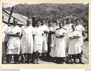 MALAGUNA ROAD, RABAUL, NEW BRITAIN. 1945-09-22. A GROUP OF NURSING ORDERLIES OF 4 FIELD AMBULANCE. THESE MEN HAVE HANDLED SOME 500 PATIENTS, MOSTLY LIBERATED INDIAN PRISONERS OF WAR, SINCE THEIR ..