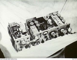 MADANG, NEW GUINEA. 1944-10-12. THE NO. 19M2 SET AND POWER UNIT FROM ABOVE INDICATING THE POWER UNIT AND RECEIVER. THE SET IS USED IN SHERMAN TANKS ENGAGED IN TESTS AT HQ 4 ARMOURED BRIGADE