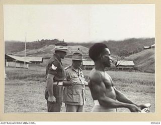 NADZAB, NEW GUINEA. 1945-05-11. GENERAL SIR THOMAS A. BLAMEY, COMMANDER-IN-CHIEF, ALLIED LAND FORCES, SOUTH WEST PACIFIC AREA (2), SPEAKS WITH SERGEANT J.C. LUCAS (1), IN CHARGE OF A PLATOON ..