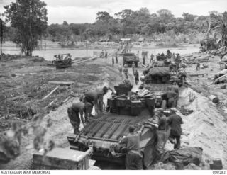 BOUGAINVILLE. 1945-03-30. TANK CREWS OF B SQUADRON, 2/4 ARMOURED REGIMENT, WATERPROOFING THEIR MATILDA TANKS PRIOR TO CROSSING THE PURIATA RIVER DURING THE MOVE FORWARD TO SUPPORT 25 INFANTRY ..