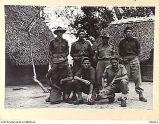 TOL AREA, NEW BRITAIN. 1945-08-02. GROUP PORTRAIT OF ALLIED INTELLIGENCE BUREAU (AIB) PERSONNEL. LEFT TO RIGHT: FRONT ROW: SERGEANT K.L. KING (1); SERGEANT J. BURROWS (2); SERGEANT L.J. BAILLIE ..