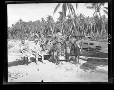 [Negative of Soldiers and Young Boys on Wrecked Plane Wing]