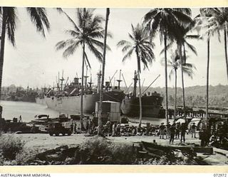 LANGEMAK BAY, NEW GUINEA. 1944-04-23. TROOPS OF THE 5TH DIVISION WAITING TO BOARD AN AMERICAN LIBERTY SHIP FOR THE JOURNEY TO SAIDOR