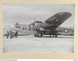 JACQUINOT BAY, NEW BRITAIN, 1945-07-03. THE ENDEAVOUR, AN AVRO YORK AIRCRAFT USED BY HIS ROYAL HIGHNESS THE DUKE OF GLOUCESTER, GOVERNOR-GENERAL OF AUSTRALIA. IT STANDS ON THE AIRSTRIP WAITING TO ..