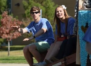 [Students converse on 2012 Homecoming float]