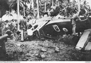 MILNE BAY, NEW GUINEA, 1942. THE P40 KITTYHAWK (Q2) AIRCRAFT FLOWN BY FLYING OFFICER FRANK GROSVENOR, NO 76 SQUADRON RAAF, CRASHED IN THE JUNGLE AFTER HE WAS SHOT DOWN OVER MILNE BAY. FLYING ..