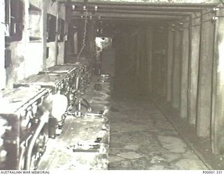 NEW BRITAIN, 1945-09. THE INTERIOR OF A JAPANESE WIRELESS RECEIVER/ TRANSMITTER INSTALLATION NEAR RABAUL. (RNZAF OFFICIAL PHOTOGRAPH.)