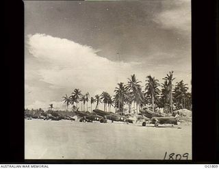 MOMOTE, LOS NEGROS ISLAND, ADMIRALTY ISLANDS, C. 1944-04. 76 KITTYHAWK SQUADRON. BACK IN THE REVETMENT AREA THE PILOTS LINE UP THEIR AIRCRAFT, CUT THE SWITCHES AND TAKE A BREATH OF RELIEF AT ..