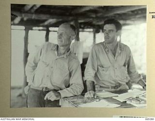 MENDAROPU, NEW GUINEAL. 1942-11. BRIGADIER GENERAL MACNIDER, COMMANDING OFFICER, 128TH REGIMENT, 32ND UNITED STATES DIVISION (1) AND MAJOR BEAVER, HIS CHIEF OF STAFF (2) PHOTOGRAPHED IN THEIR ..