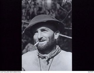 PAPUA, NEW GUINEA, 1942-10. LIEUTENANT H.F. HAYES, 2/32ND AUSTRALIAN INFANTRY BATTALION WHO HAS A MONTHS BEARD ON, PHOTOGRAPHED AT NAURO