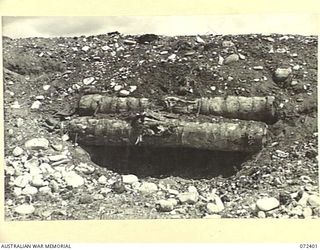 WANDOKAI, NEW GUINEA. 1944-04-17. THE EFFECTS AGAINST A JAPANESE BUNKER OF 5 ROUNDS OF ARMOUR PIERCING SHOT FIRED FROM A MATILDA TANK DURING TESTS CONDUCTED BY THE OPERATIONAL RESEARCH SECTION, ..