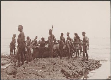 Solomon Islanders launching boat, Te Motu, Santa Cruz Group, Solomon Islands, 1906 / J.W. Beattie