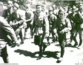 THE SOLOMON ISLANDS, 1945-09-19. JAPANESE SOLDIERS FROM NAURU ISLAND EN ROUTE TO AN INTERNMENT CAMP ON BOUGAINVILLE ISLAND. (RNZAF OFFICIAL PHOTOGRAPH.)