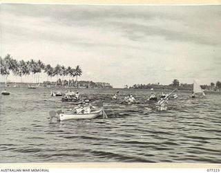 MADANG, NEW GUINEA. 1944-12-14. A CANOE AND LAKATOI RACE IN PROGRESS DURING THE 2/4TH ARMOURED REGIMENT SPORTS AFTERNOON