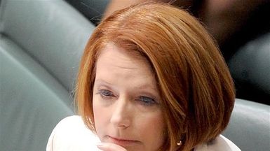 Gillard challenges Abbott to stop partisan politics on asylum seekers