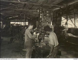 Port Moresby, New Guinea. 1944-05-30. Interior of a section of the General Engineering Shop, 1 Watercraft Workshop, Australian Electrical and Mechanical Engineers (AEME)