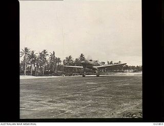 MOMOTE, LOS NEGROS ISLAND, ADMIRALTY ISLANDS, C. 1944-04. BACK FROM A SORTIE, AIRCRAFT OF NO. 76 (KITTYHAWK) SQUADRON RAAF COME IN FOR A GRACEFUL LANDING AT FORTY SEVEN SECOND INTERVALS