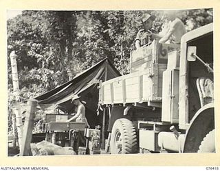 LAE, NEW GUINEA. 1944-10-03. PERSONNEL OF NO.1 PLATOON, 12TH FIELD COMPANY, PACKING UP THEIR GEAR IN PREPARATION FOR MOVING CAMP. IDENTIFIED PERSONNEL ARE:- WX32222 CORPORAL G.D. MOFFATT (1); ..