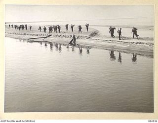 JABA RIVER AREA, BOUGAINVILLE, SOLOMON ISLANDS. 1944-12-18. D COMPANY, 15 INFANTRY BATTALION TROOPS MOVING ACROSS TO ESTABLISH POSITIONS SOUTH OF THE RIVER. 42 LANDING CRAFT COMPANY CROSSED THE ..